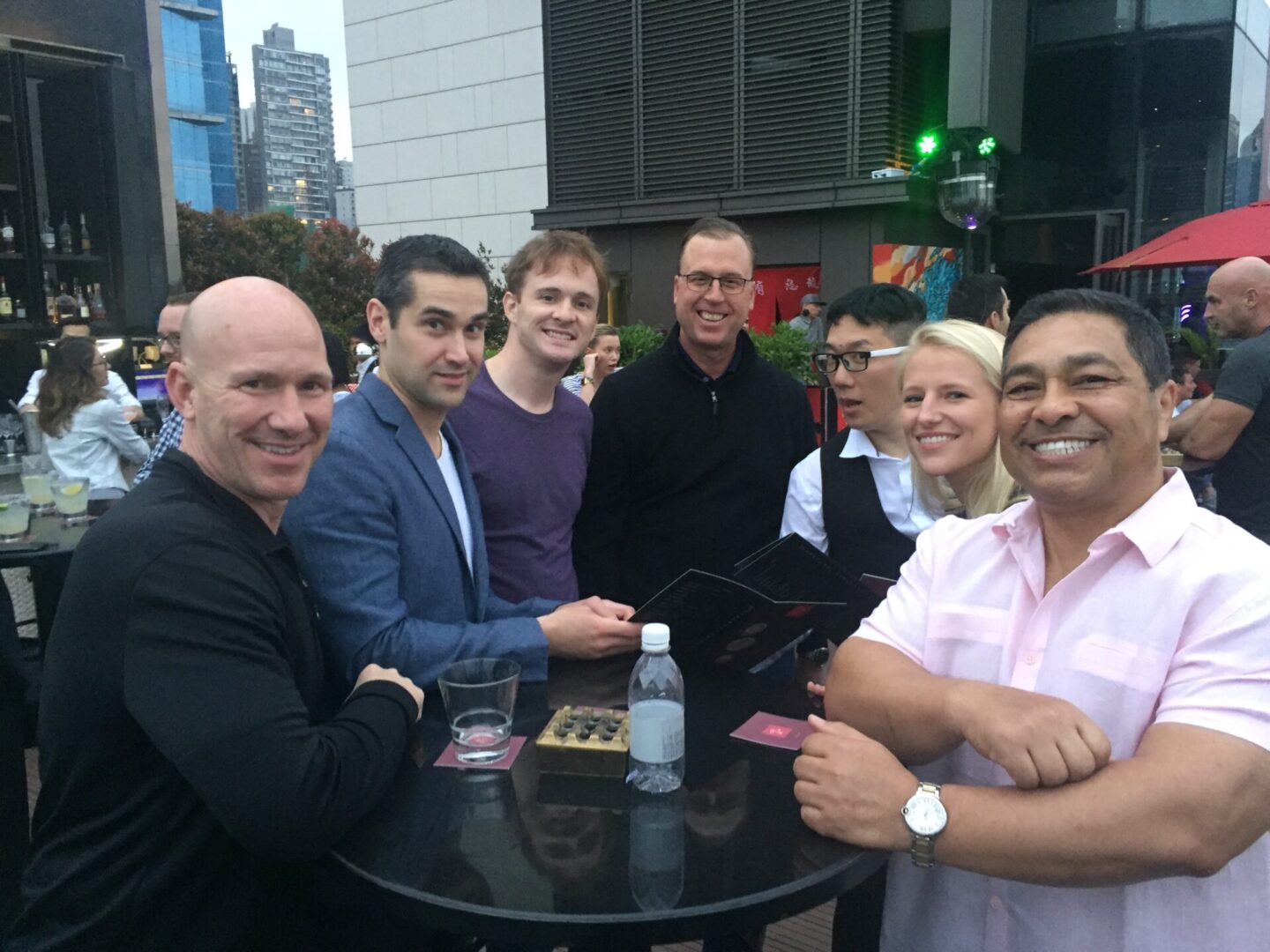 A group of people sitting at a table.